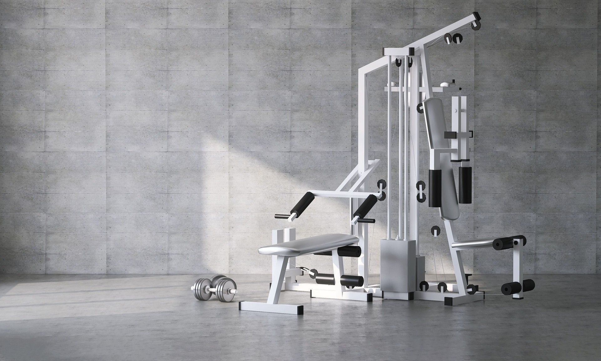 Luxury gym, exercise and sport equipment in modern gray concrete room at home