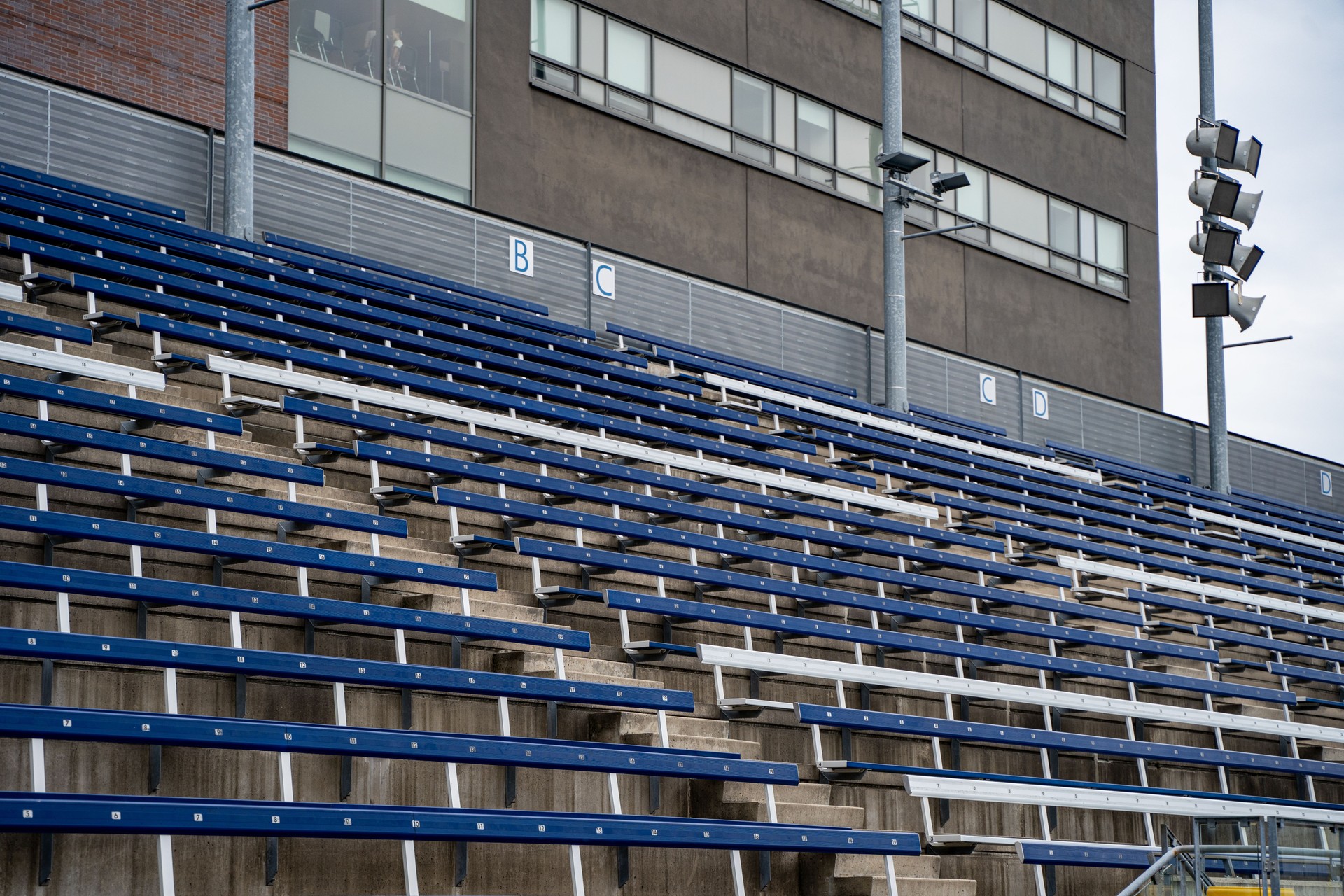 Blue and white seats in the stands.